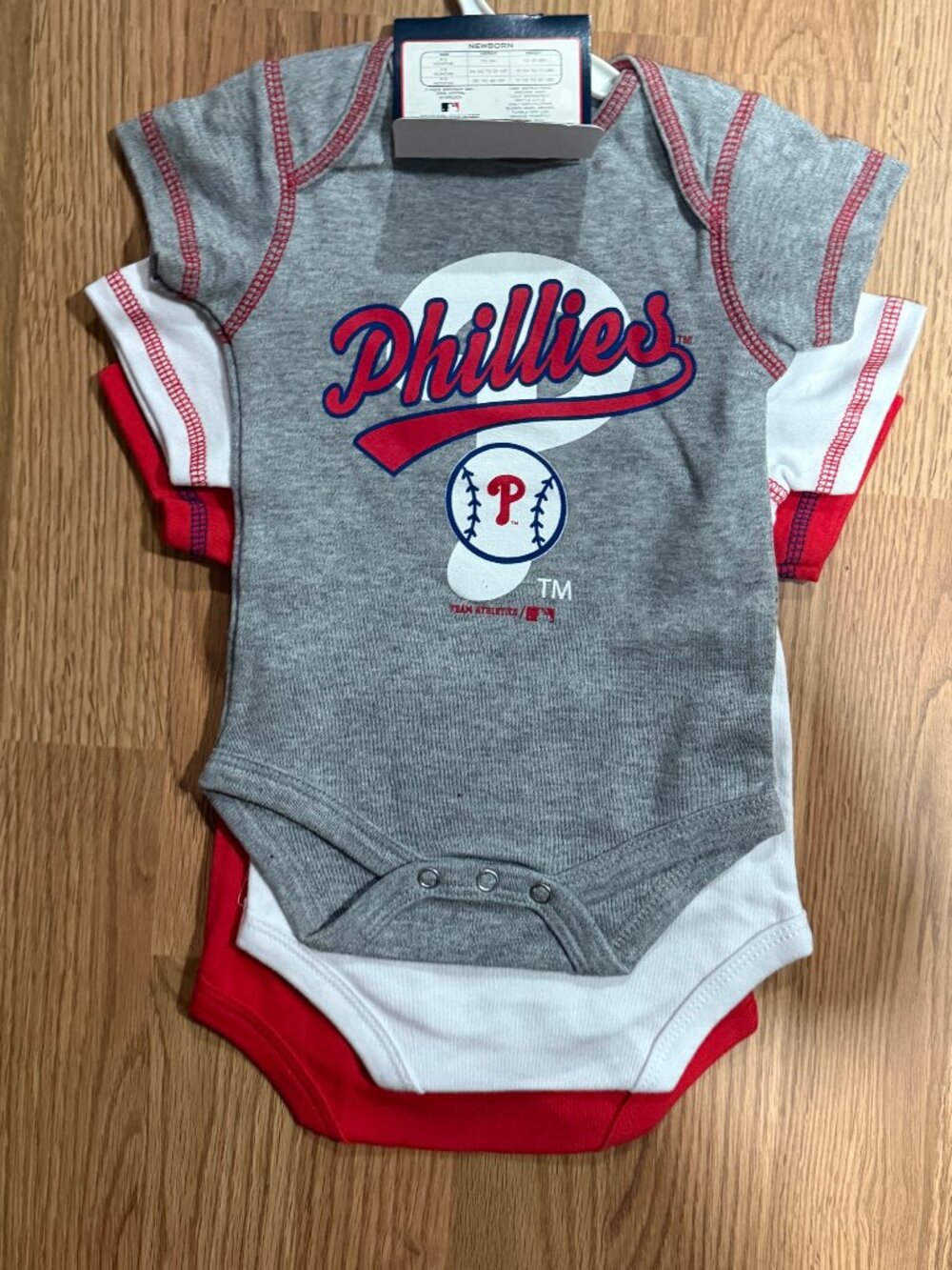 NWT PHILLIES SET OF THREE ONSIES, HAT, BIB AND BOOTIES SIZE 0/3 MONTHS